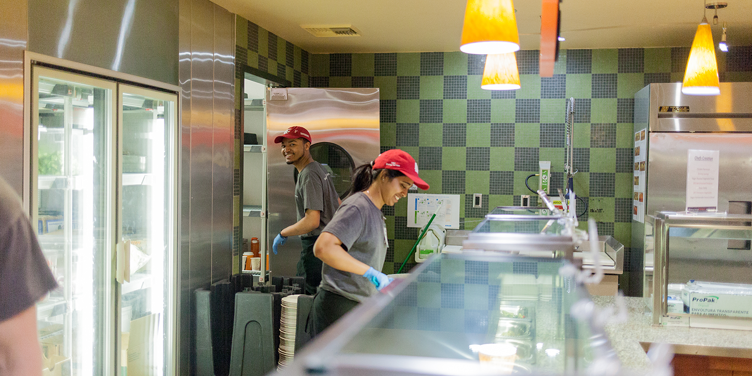 Two student employees working.